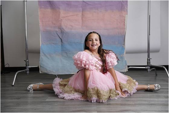 Camper posed on a hand-painted studio set