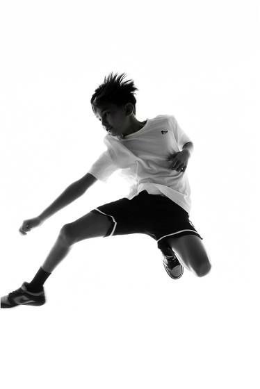 Camper photographed in motion against a studio backdrop