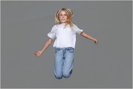 Camper photographed in motion against a studio backdrop