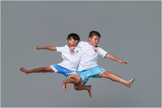 Camper photographed in motion against a studio backdrop
