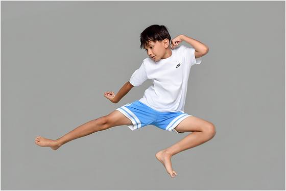 Camper photographed in motion against a studio backdrop