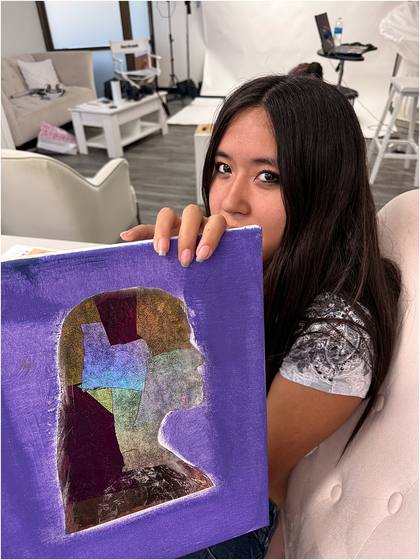 Campers holding finished canvas collage pieces